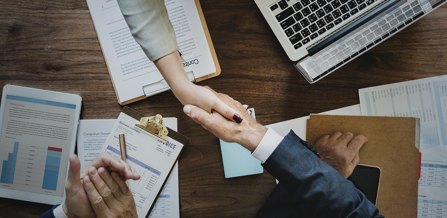 handshake over desk