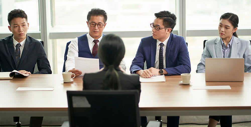 people interviewing another person