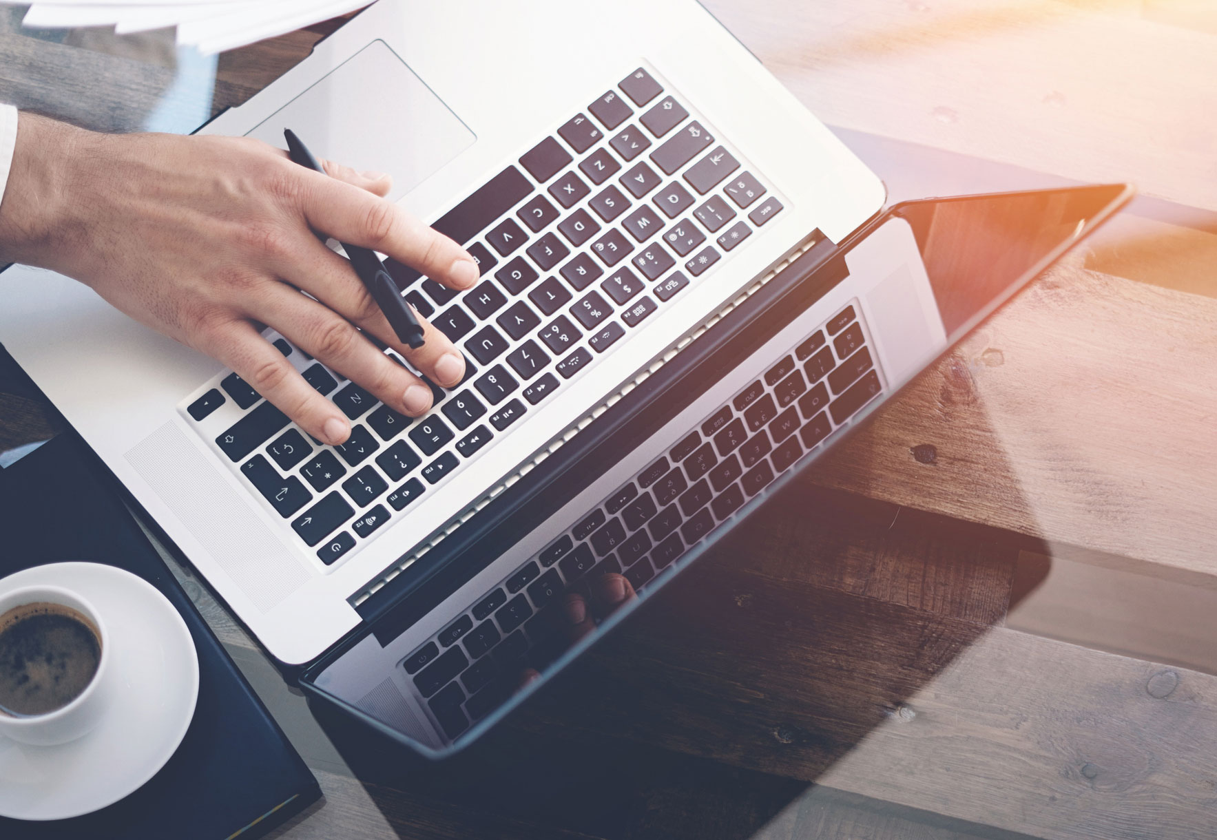 person typing on laptop