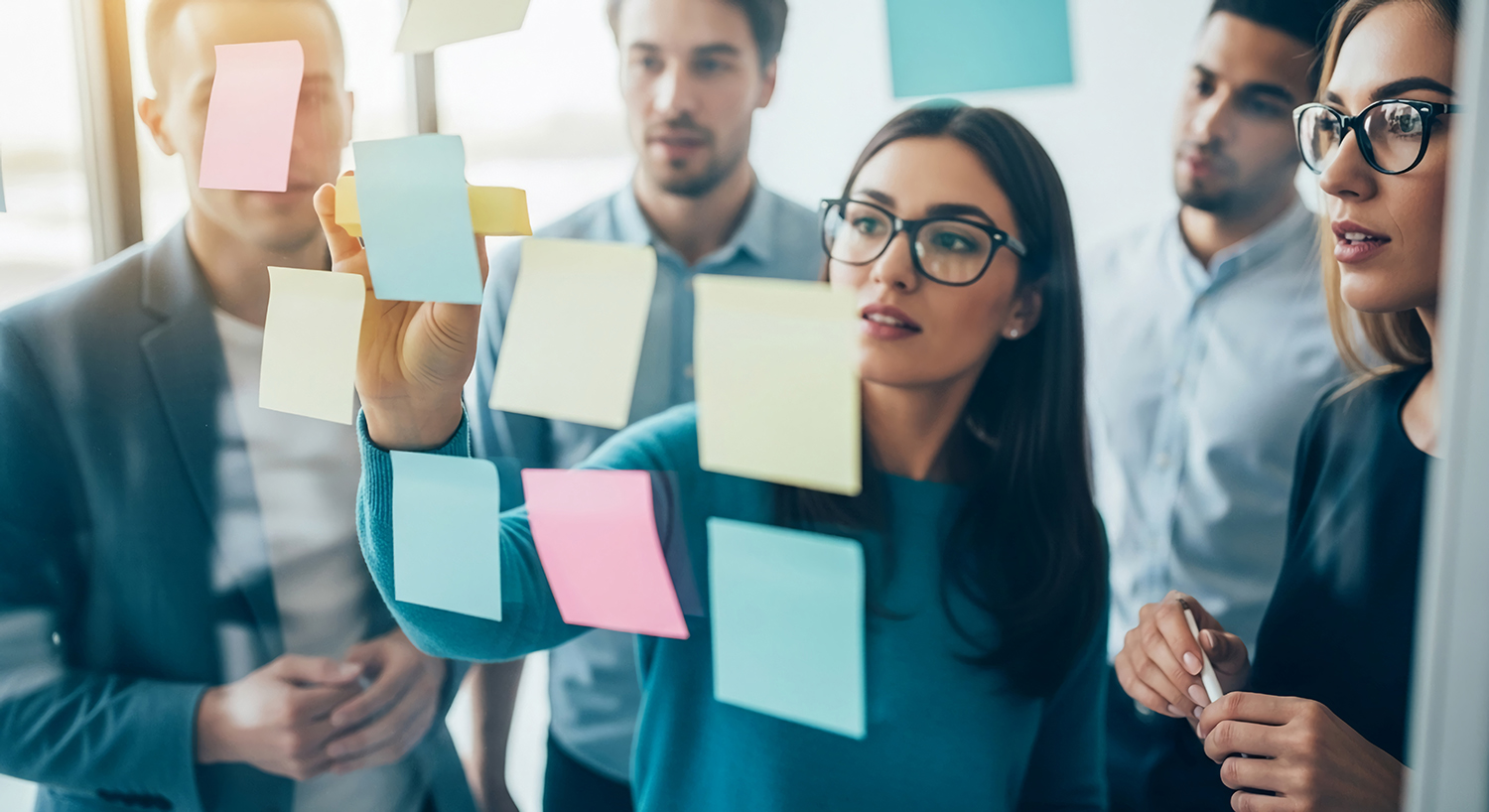 A business meeting with employees using colorful sticky notes