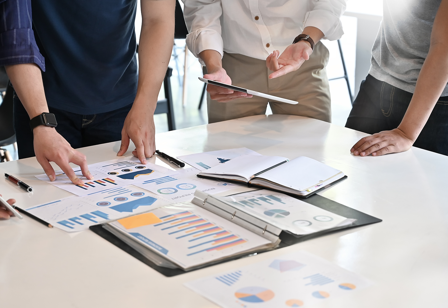 Office workers viewing financial reports